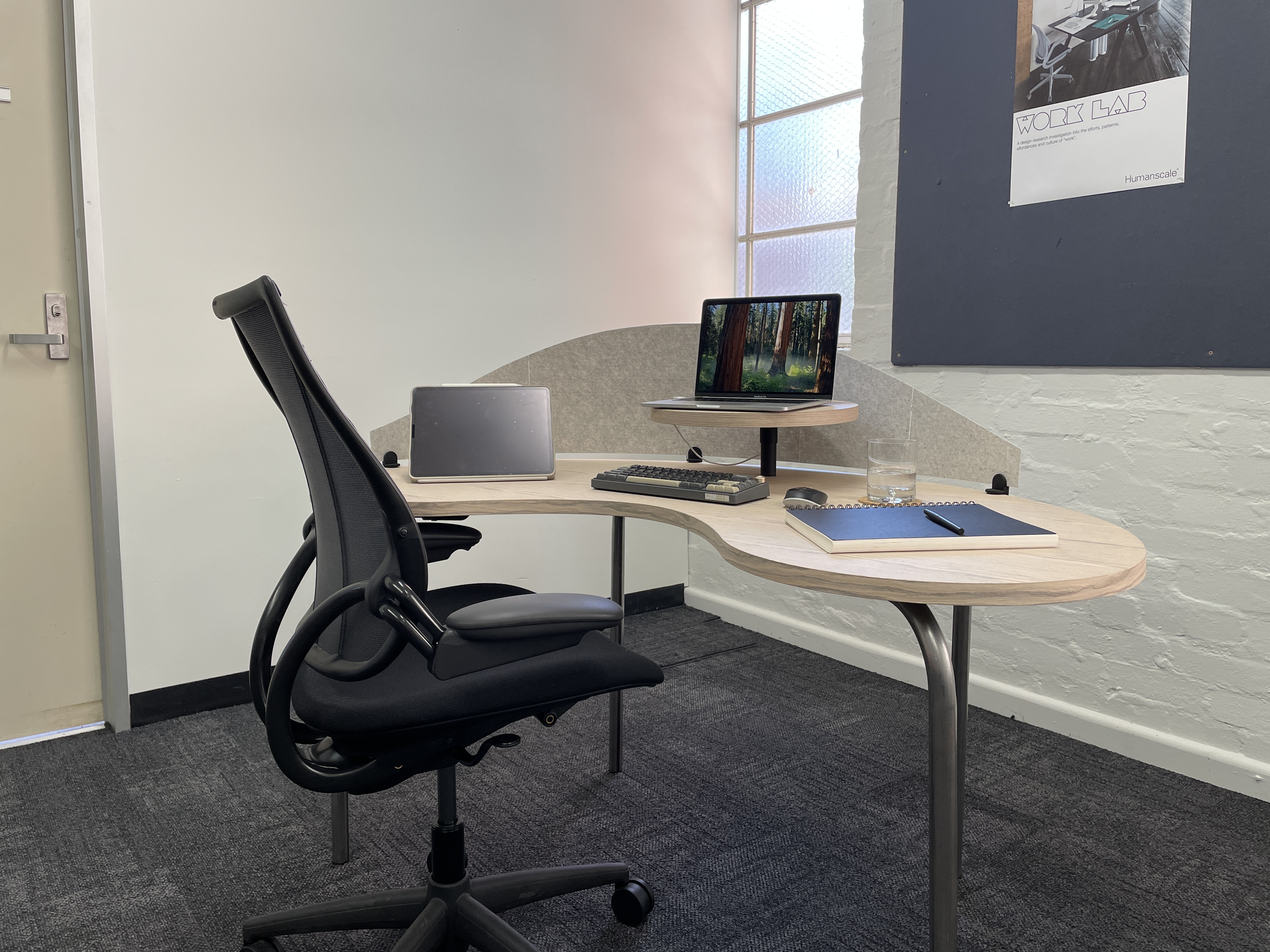 The Kidney Desk — a soft, kidney-shaped oak veneer workspace with a raised laptop platform