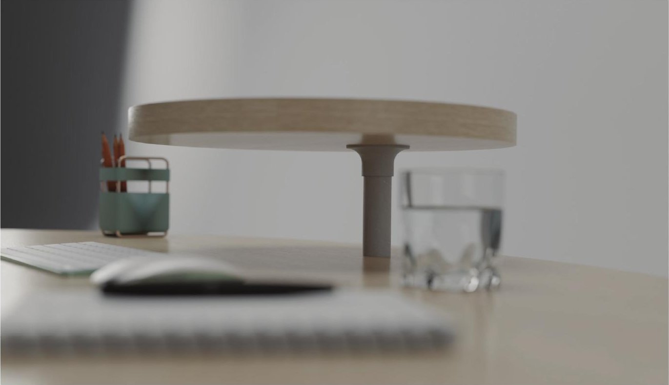 Close-up of the raised laptop platform with cable management hole